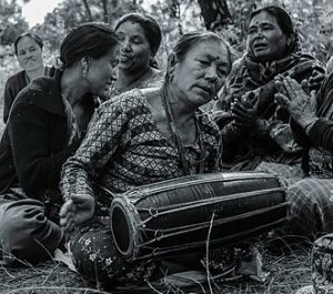 Nepali woman playing maadal