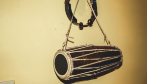 The Madal is known for its distinctive rhythmic patterns and is used in various cultural, religious, and social occasions.